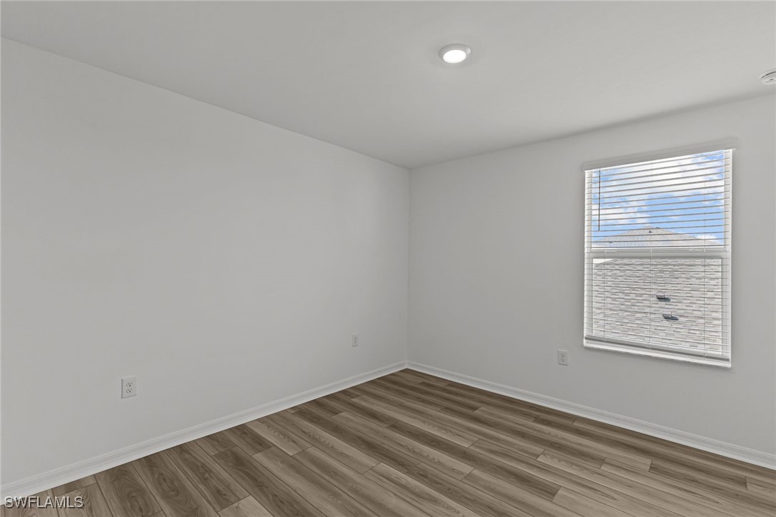 43153 Wild Indigo Road, Unit DOGWOOD Babcock Ranch, FL 33982 - Photo 13 of 20 an empty room with a window