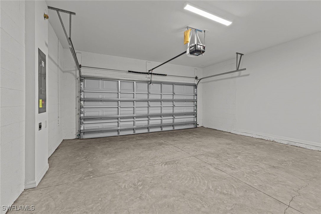 43153 Wild Indigo Road, Unit DOGWOOD Babcock Ranch, FL 33982 - Photo 15 of 20 a view of a garage