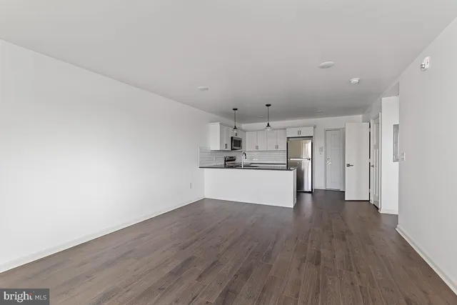 a view of kitchen with wooden floor