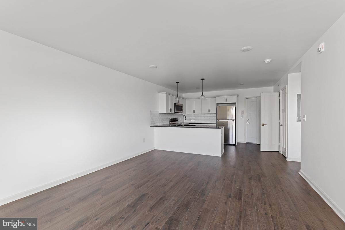 404 Fountain Street, Unit 406 Philadelphia, PA 19128 - Photo 6 of 10 a view of kitchen with wooden floor