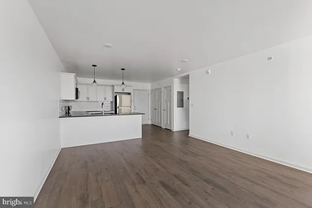 a view of kitchen with wooden floor