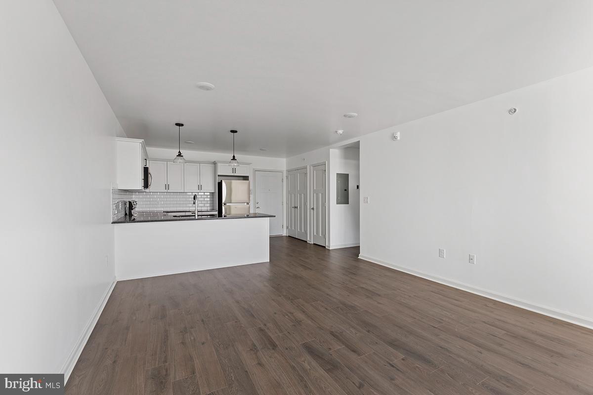 404 Fountain Street, Unit 406 Philadelphia, PA 19128 - Photo 7 of 10 a view of kitchen with wooden floor