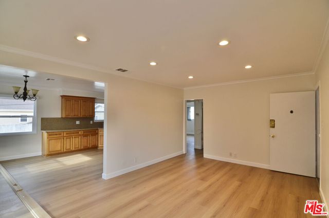 a view of a kitchen with a sink and a stove top oven
