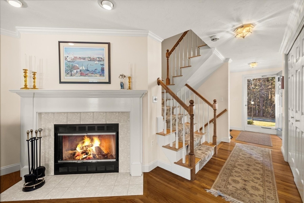 55 Bay Farm Road, Unit 55 Duxbury, MA 02332 - Photo 16 of 37 a living room with furniture and a fireplace