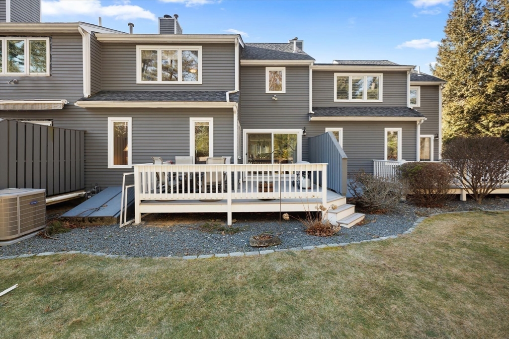 55 Bay Farm Road, Unit 55 Duxbury, MA 02332 - Photo 30 of 37 a view of a house with a yard and deck