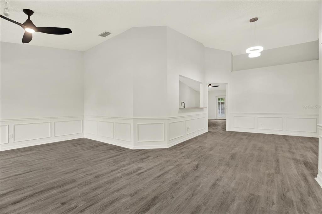 1712 Elk Spring Drive Brandon, FL 33511 - Photo 4 of 21 a view of an empty room with wooden floor