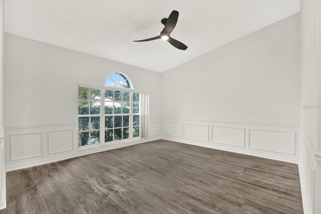 1712 Elk Spring Drive Brandon, FL 33511 - Photo 6 of 21 wooden floor in an empty room with a window