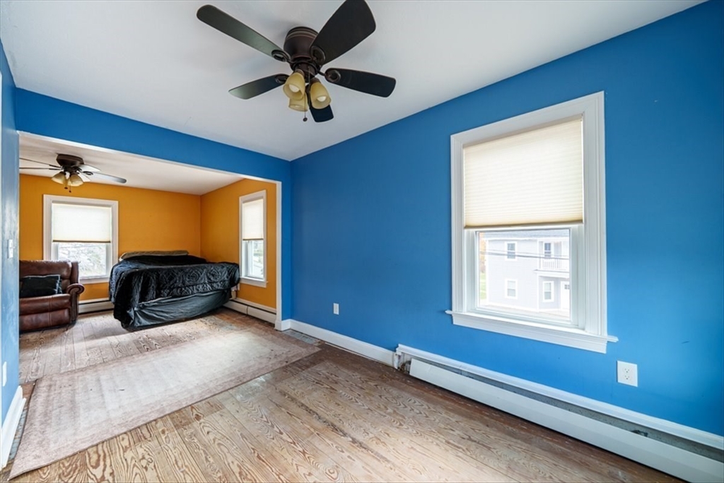 95 Lake Street Webster, MA 01570 - Photo 15 of 40 a bedroom with furniture and a large window
