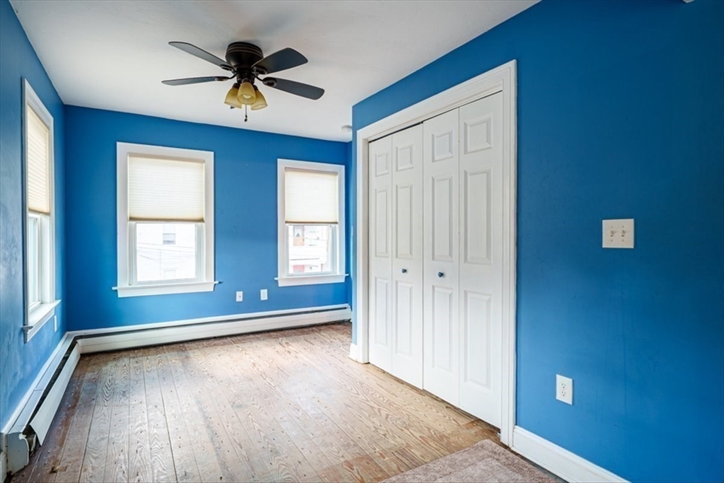 95 Lake Street Webster, MA 01570 - Photo 19 of 40 an empty room with wooden floor and windows