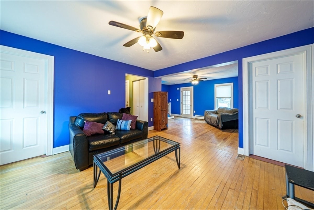 95 Lake Street Webster, MA 01570 - Photo 21 of 40 a living room with furniture and a wooden floor