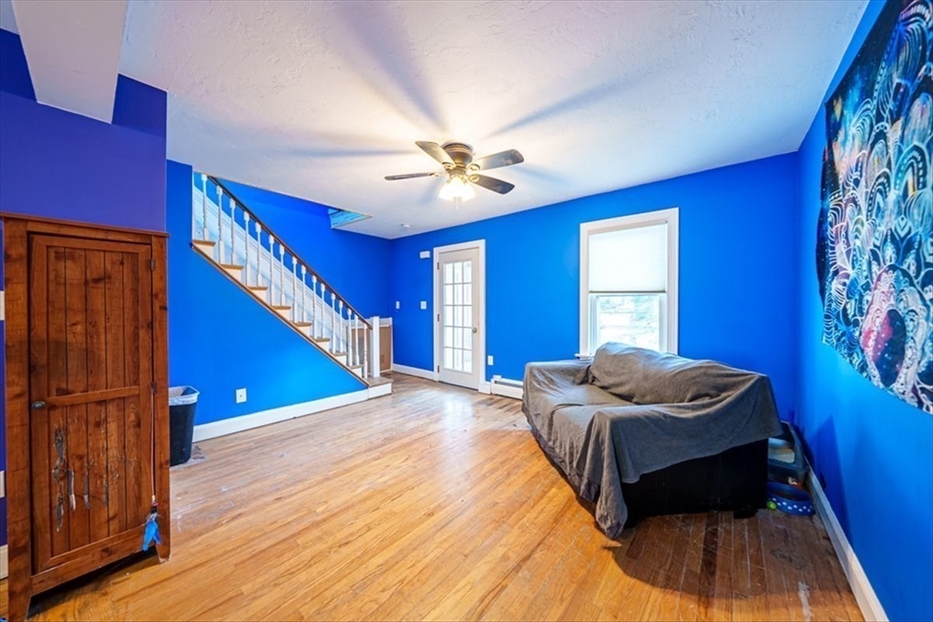 95 Lake Street Webster, MA 01570 - Photo 22 of 40 a bedroom with a bed and a ceiling fan