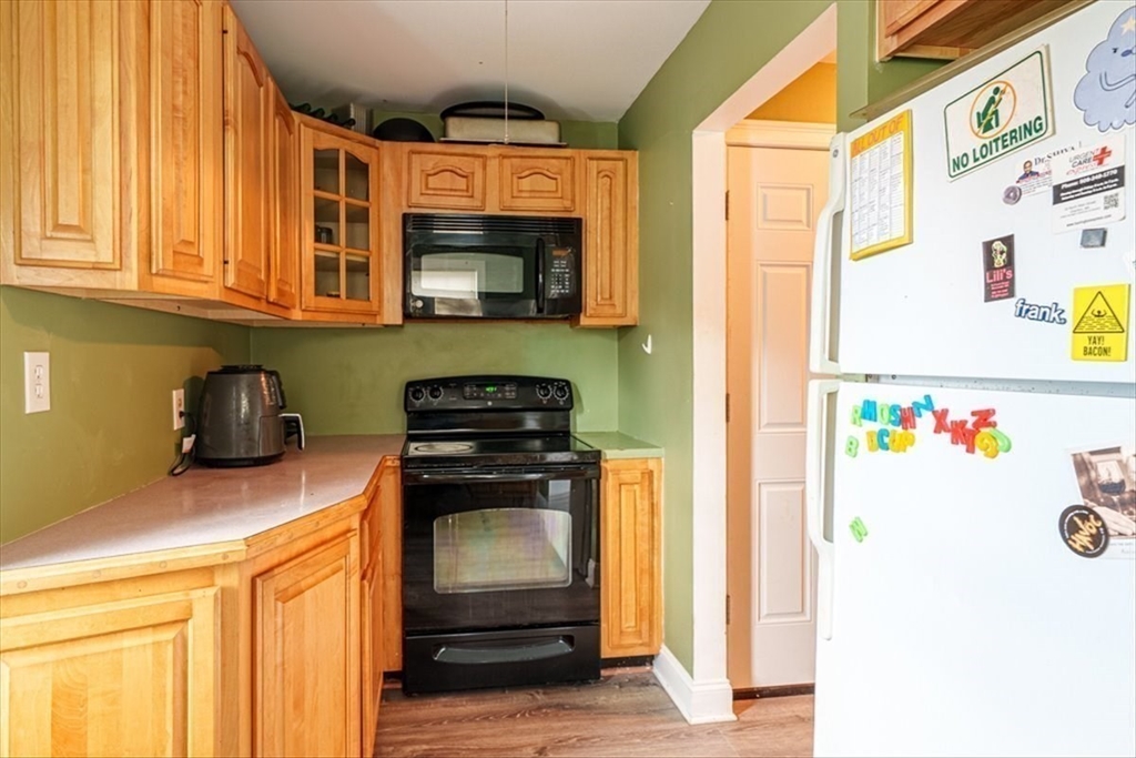 95 Lake Street Webster, MA 01570 - Photo 26 of 40 a kitchen with stainless steel appliances granite countertop a refrigerator and a stove top oven