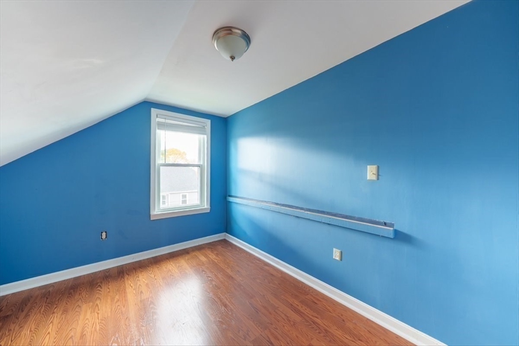 95 Lake Street Webster, MA 01570 - Photo 28 of 40 a view of empty room with wooden floor and fan