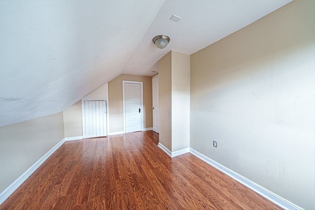 95 Lake Street Webster, MA 01570 - Photo 31 of 40 a view of room with window and wooden floor