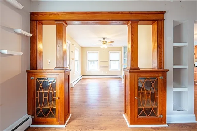 a view of front door with wooden floor
