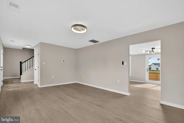 a view of a kitchen with furniture cabinet and a kitchen
