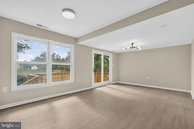 a kitchen with stainless steel appliances a stove a sink a refrigerator and cabinets