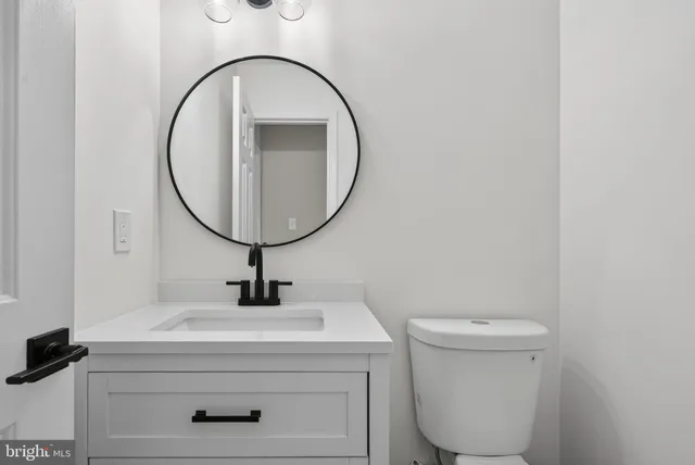 wooden view of a bathroom with a sink