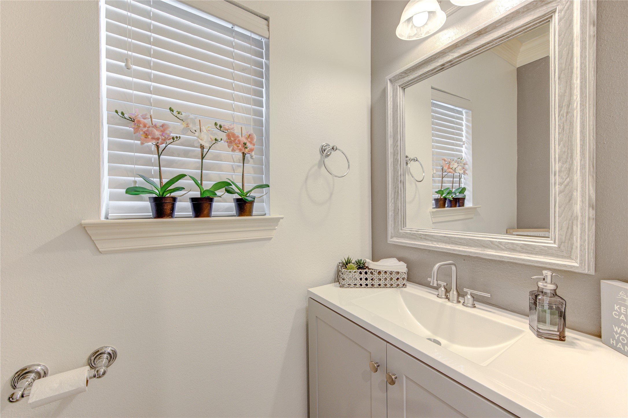 1131 Sopris Drive Houston, TX 77077 - Photo 18 of 35 a bathroom with a sink mirror and window