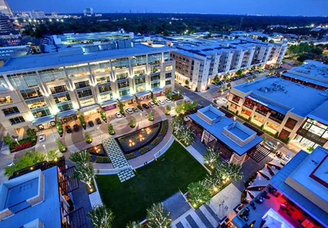 an aerial view of multiple houses with yard