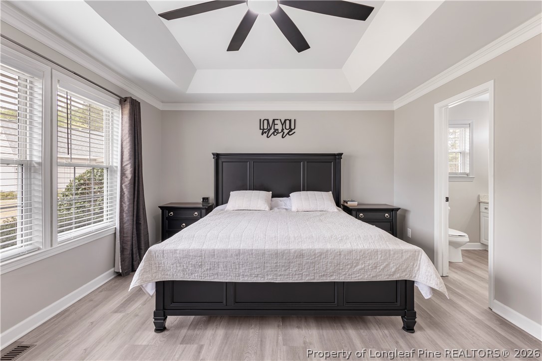 253 Farmstead Court Rockingham, NC 28379 - Photo 5 of 25 a large bed sitting in a bedroom next to a window