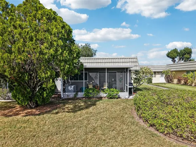 a front view of house with outdoor seating
