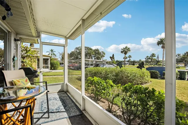 a view of a lake with houses in the back