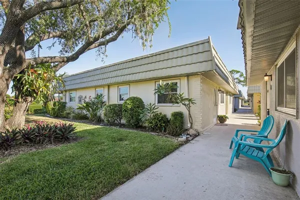 a view of a lake with houses in the back