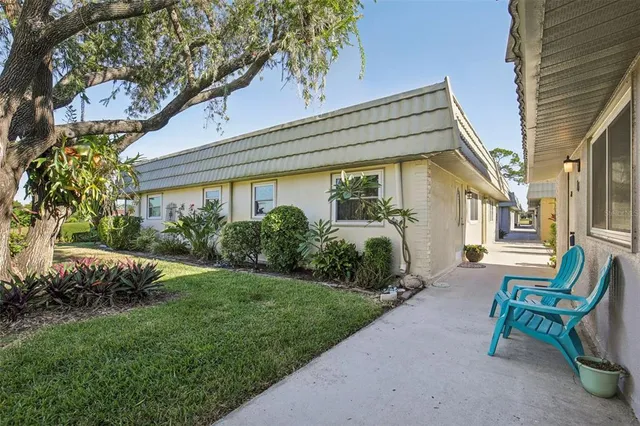 a view of a lake with houses in the back