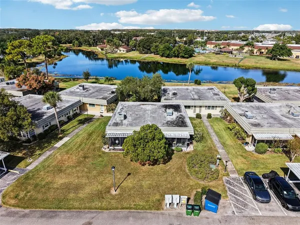 an aerial view of a house with a ocean view