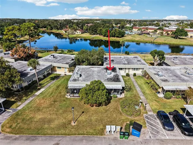 an aerial view of a residential houses with outdoor space