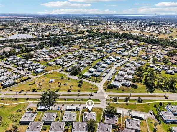 an aerial view of residential houses with outdoor space