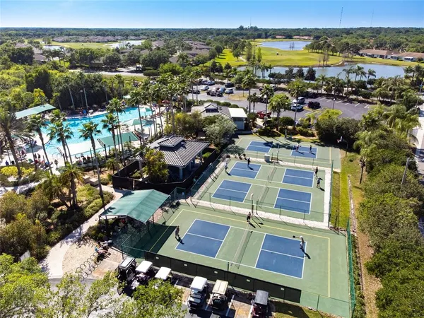 an aerial view of a residential houses with outdoor space