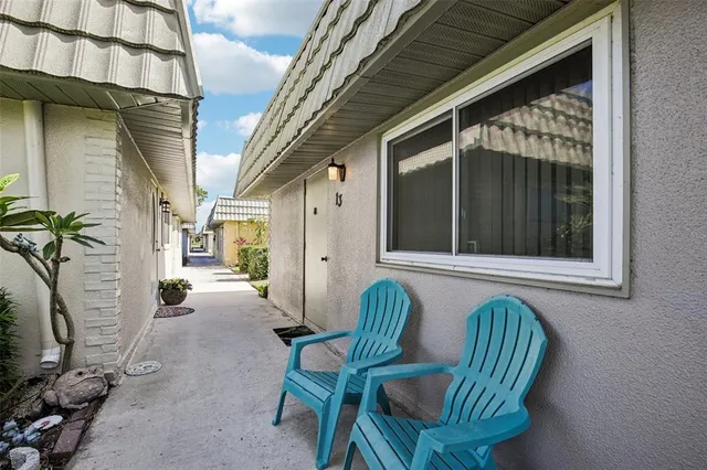 a view of balcony with furniture