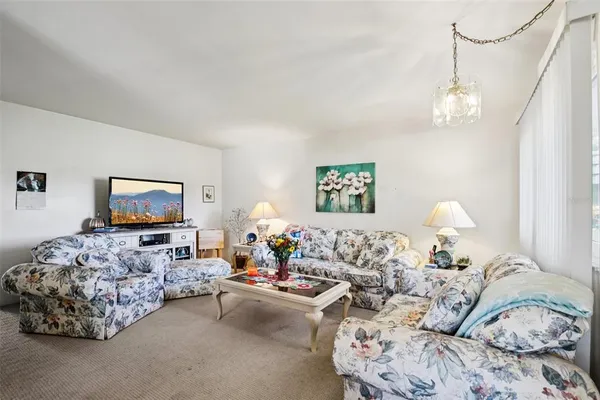 a living room with furniture or couch and a window