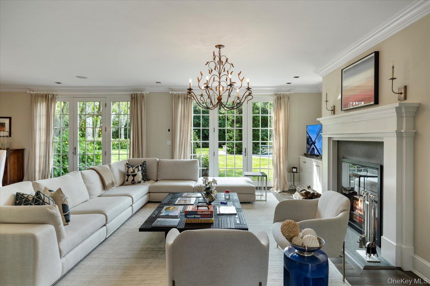 231 Flying Point Road Southampton, NY 11968 - Photo 11 of 34 a living room with furniture and a large window