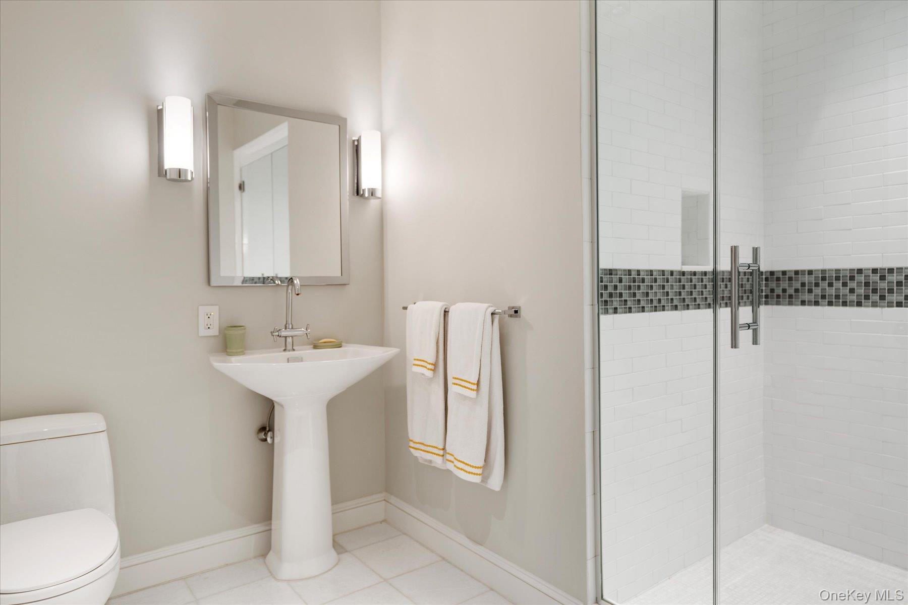 231 Flying Point Road Southampton, NY 11968 - Photo 32 of 34 a bathroom with a sink a toilet and mirror