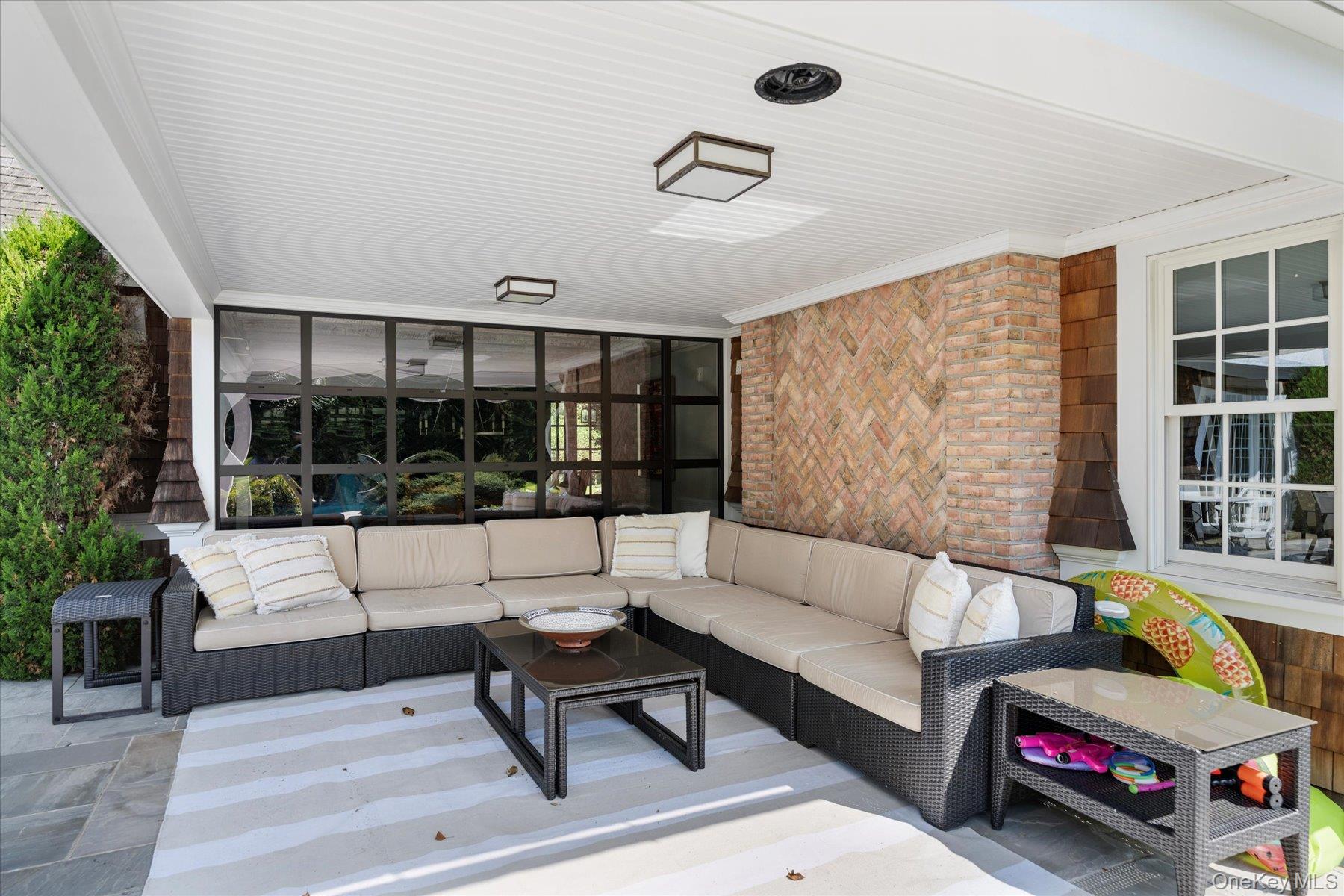 231 Flying Point Road Southampton, NY 11968 - Photo 33 of 34 a living room with furniture and a large window