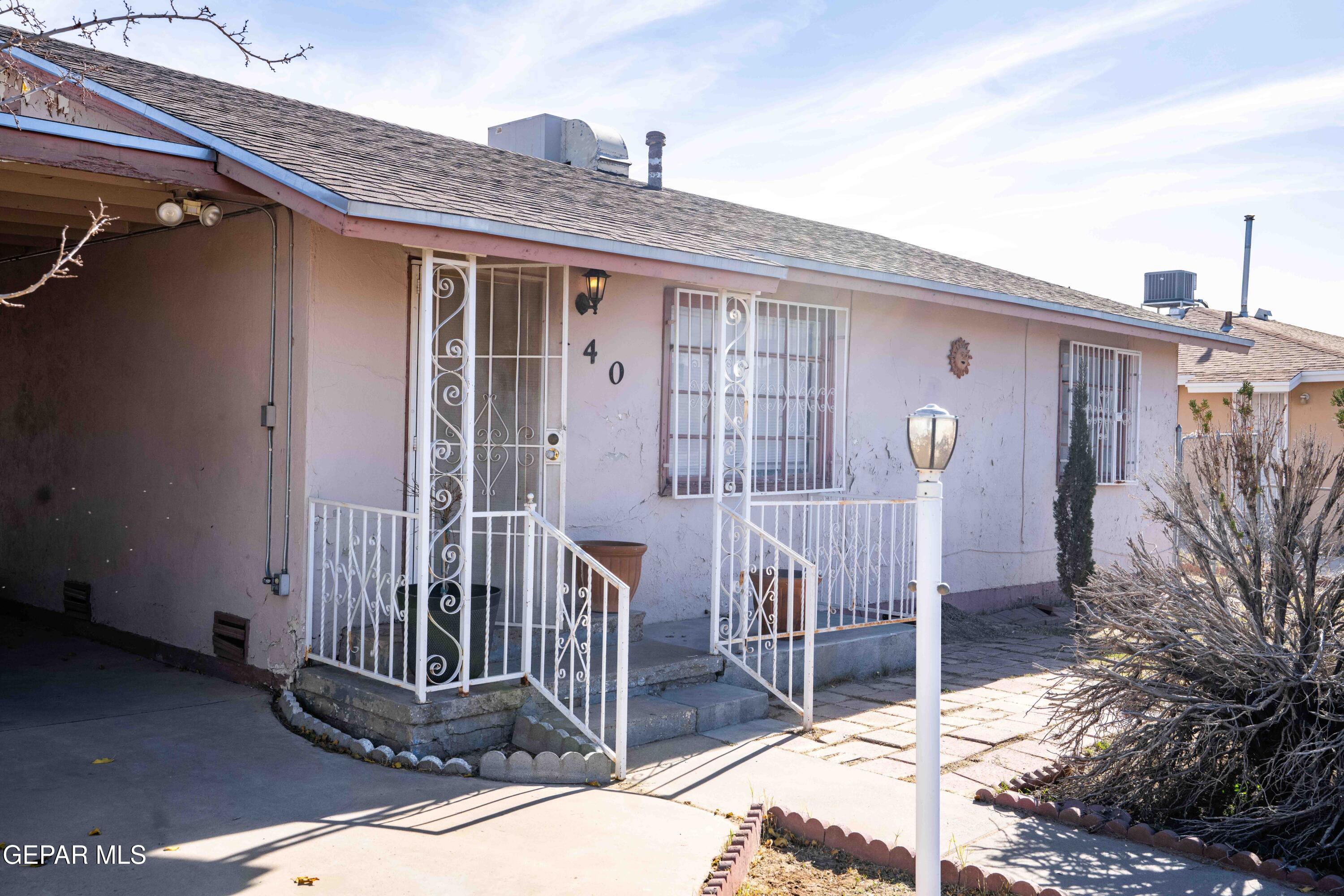 140 Teakwood Road El Paso, TX 79915 - Photo 2 of 16 a view of a house with a small yard and wooden fence