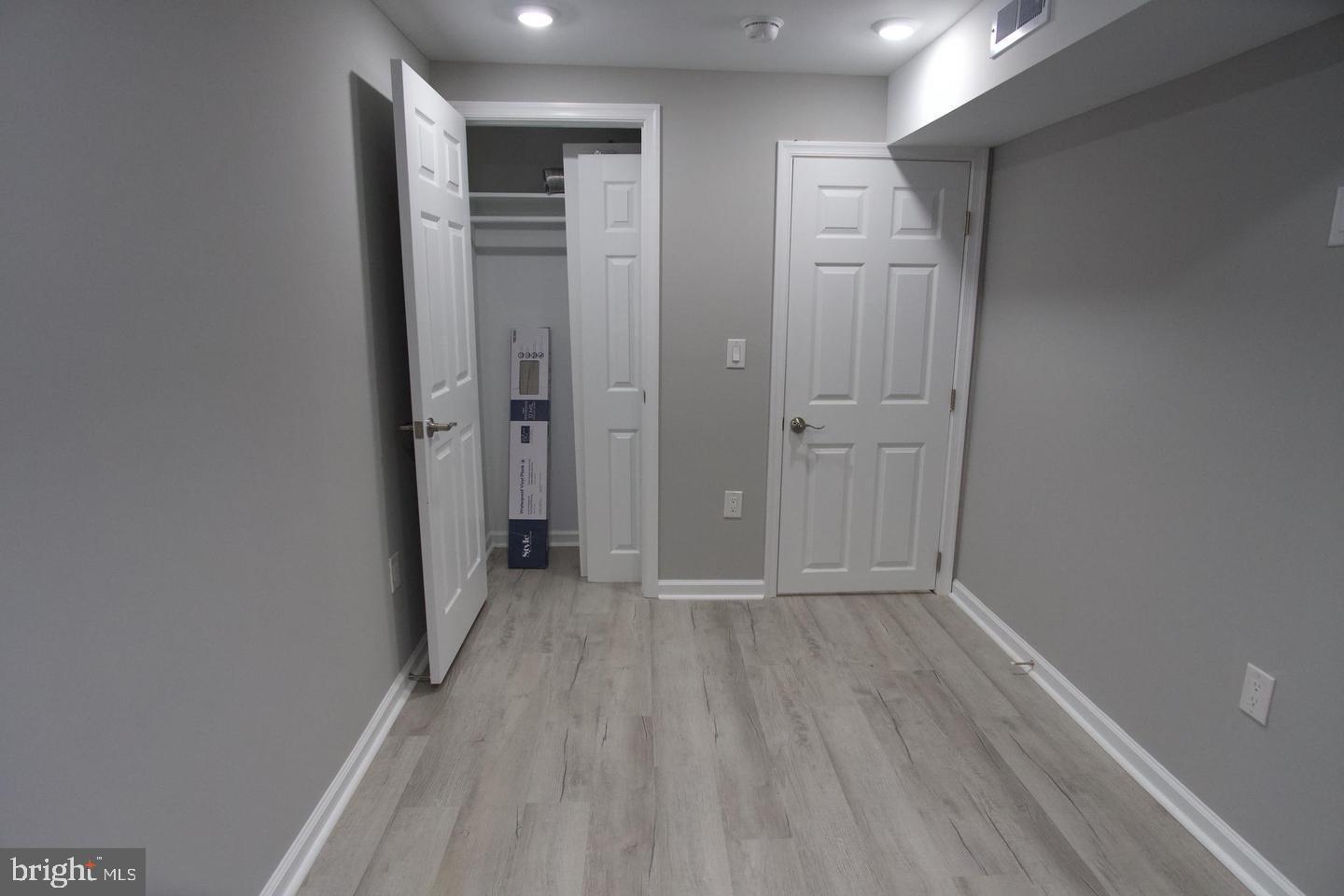 630 Brooklyn Street, Unit 1 Philadelphia, PA 19104 - Photo 4 of 7 a view of an empty room with wooden floor and closet area