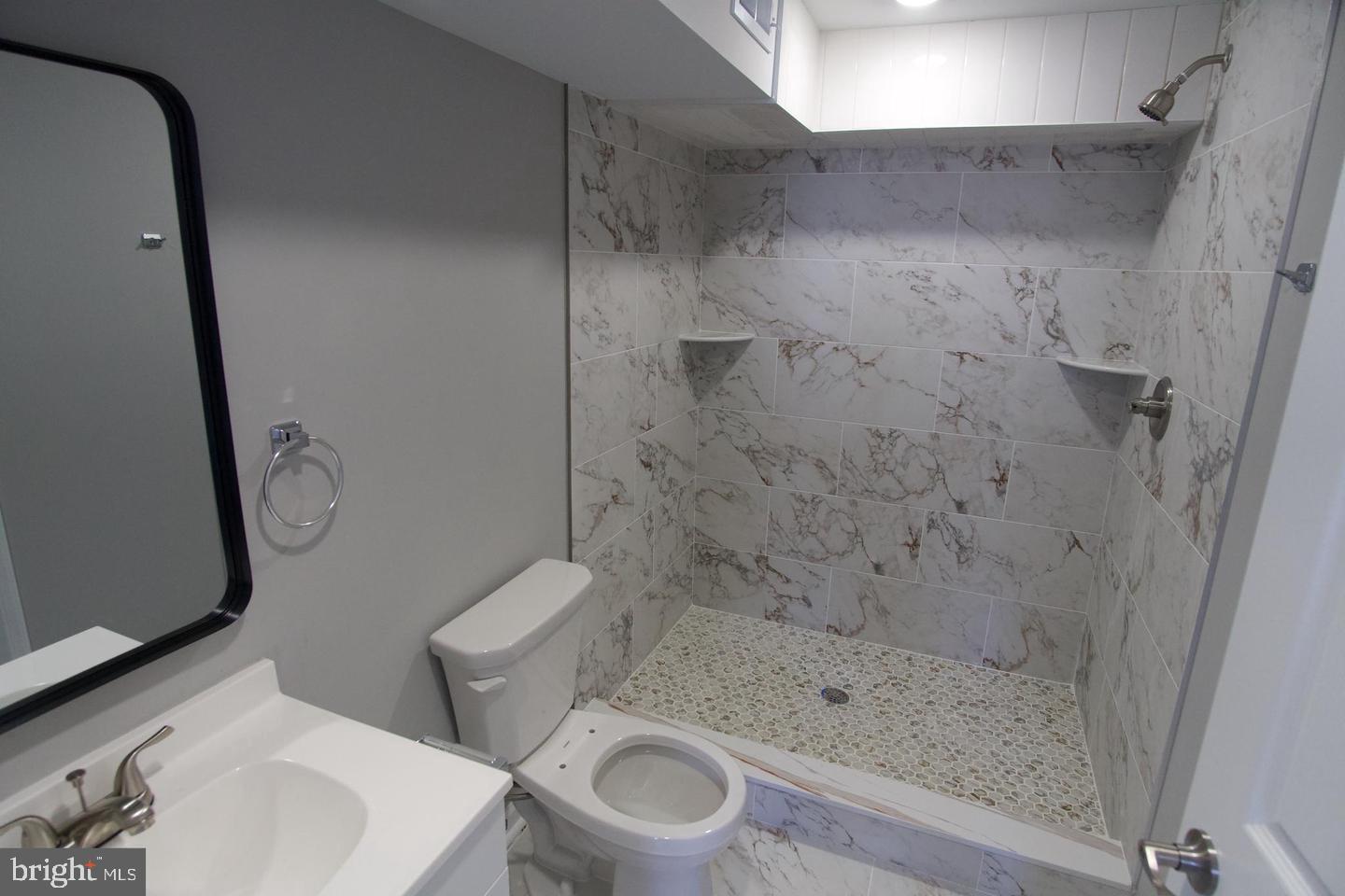 630 Brooklyn Street, Unit 1 Philadelphia, PA 19104 - Photo 5 of 7 a bathroom with a shower and a toilet