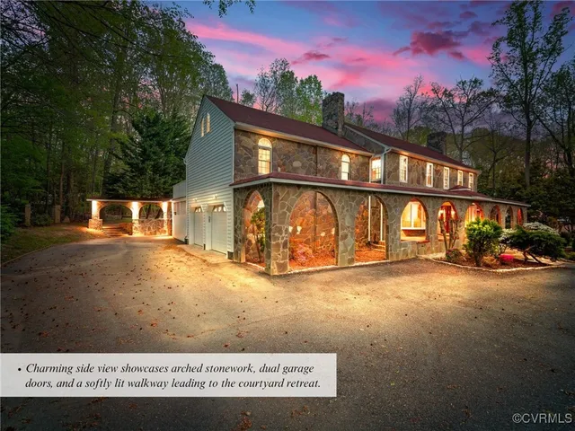 a living room with furniture or couch and a chandelier