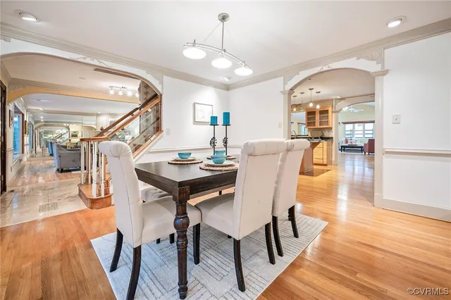 a view of a dining room with furniture and wooden floor