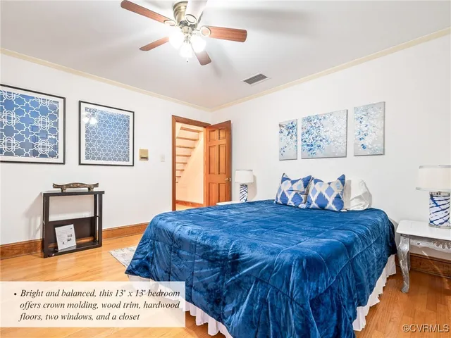a backyard of a house with potted plants and large tree
