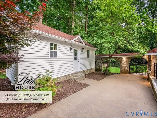 a view of a white house with a large windows