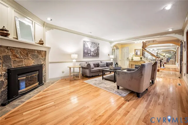 a living room with furniture and a fireplace