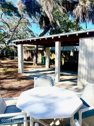 a view of a yard with a tree