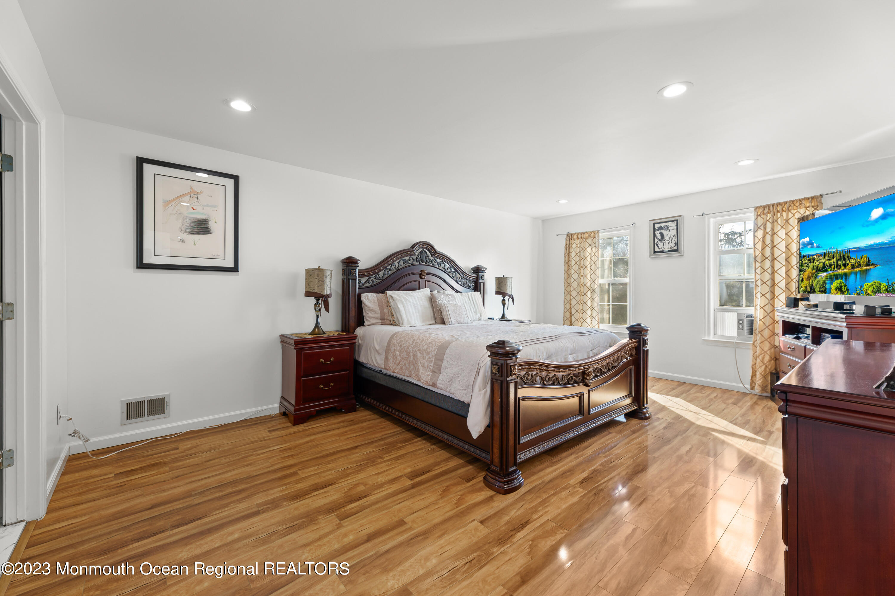 33 Morganville Road Matawan, NJ 07747 - Photo 14 of 41 a bedroom with a bed and wooden floor