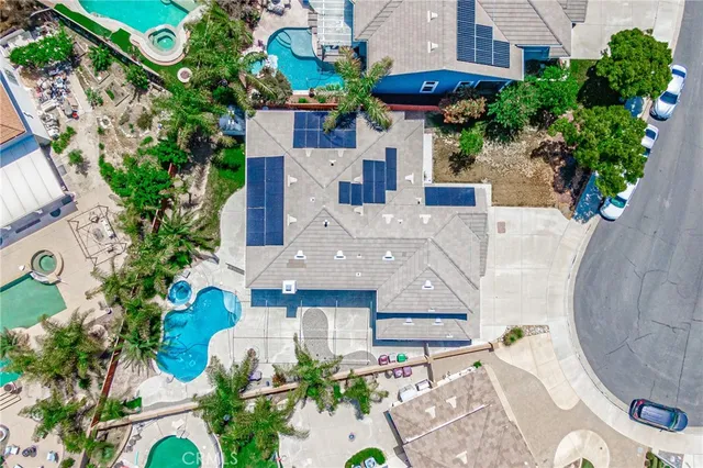 an aerial view of a house with a swimming pool