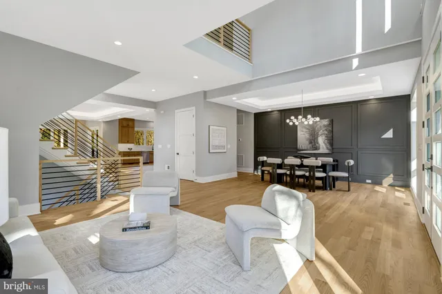 a view of a livingroom with furniture window and wooden floor